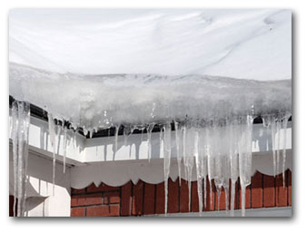 Ice dam buildup at a roof edge shown on Titan Roofing's website